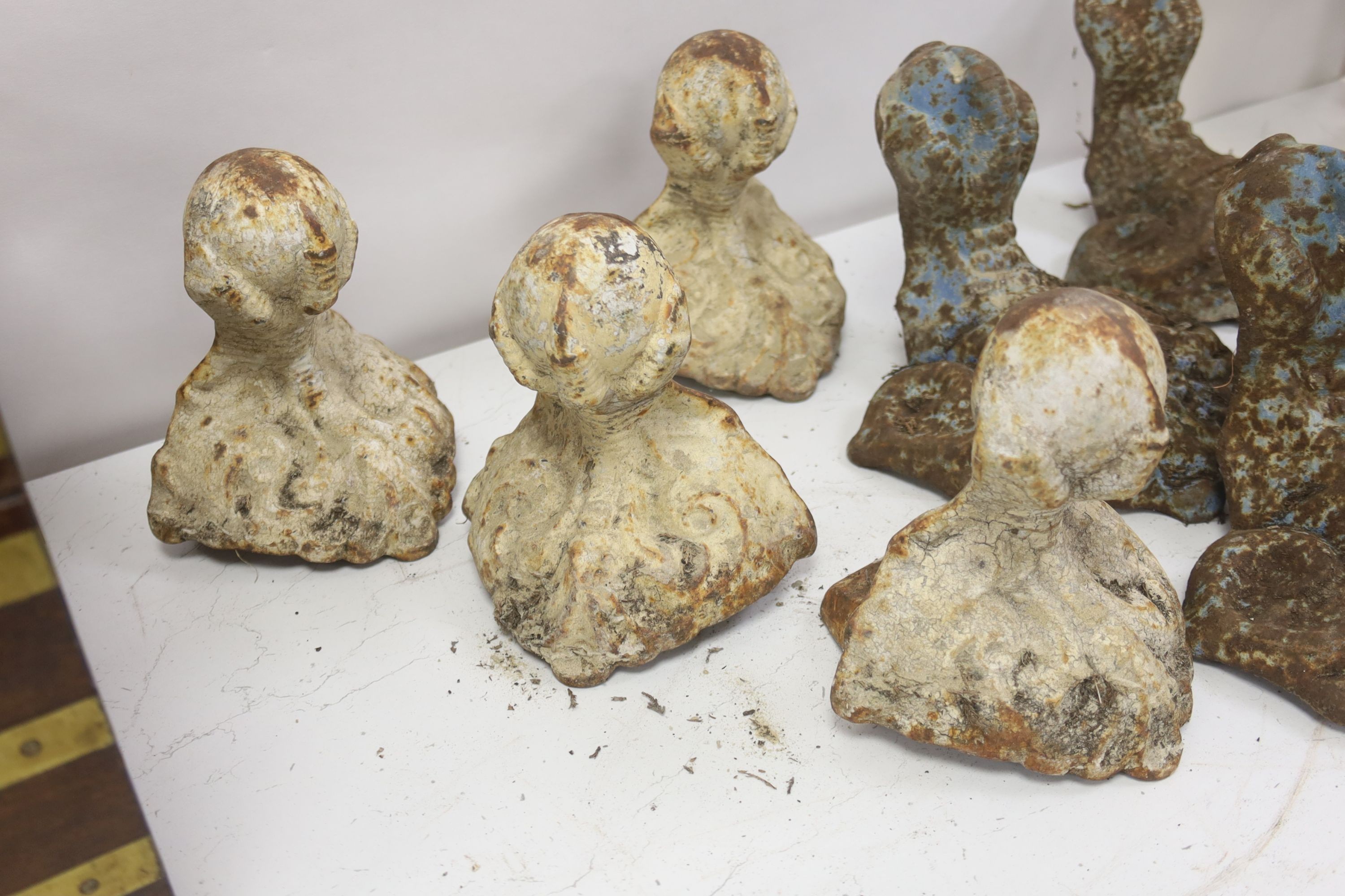 Two sets of four Victorian cast iron claw and ball feet